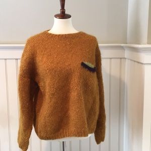 Yellow sweater with breast pocket